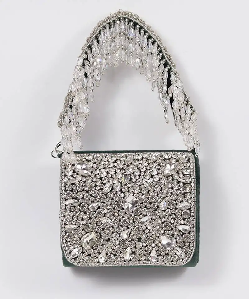 Green suede mini bag with embroidered handle