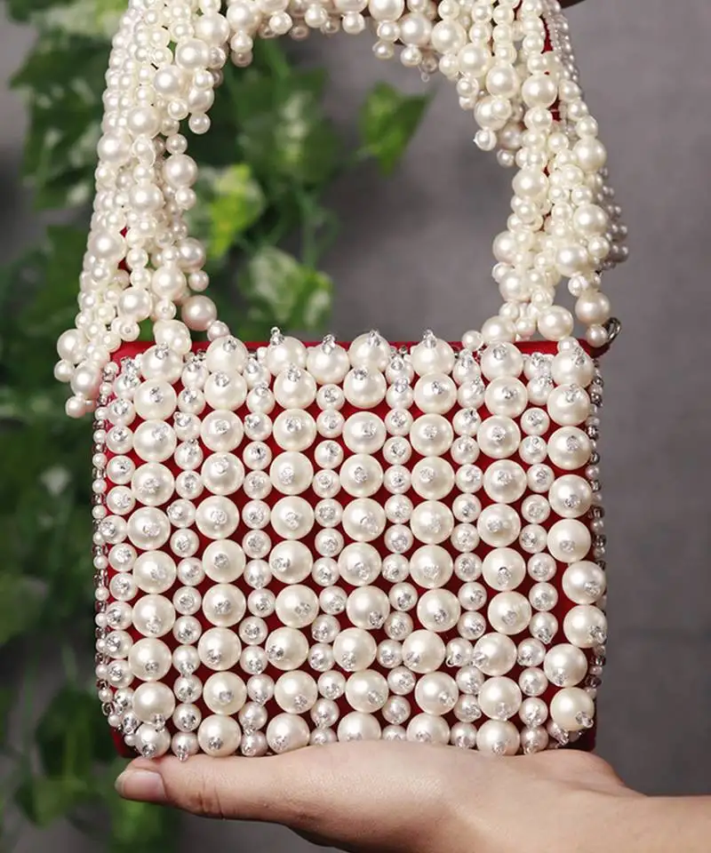 Red suede mini bag with embroidered handle