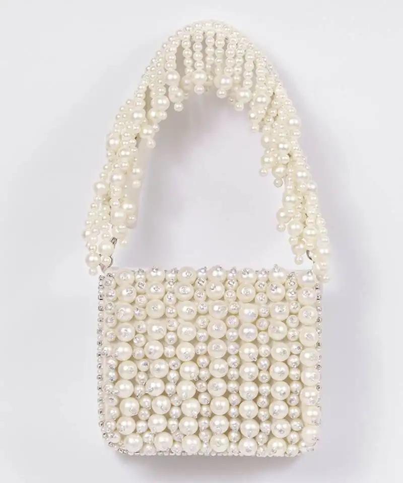 Suede white mini bag with embroidered handle