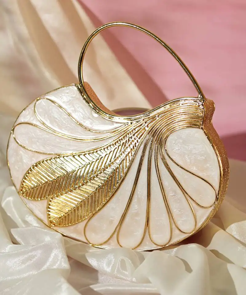 Gold embellished mother of pearl clutch with detachable chain