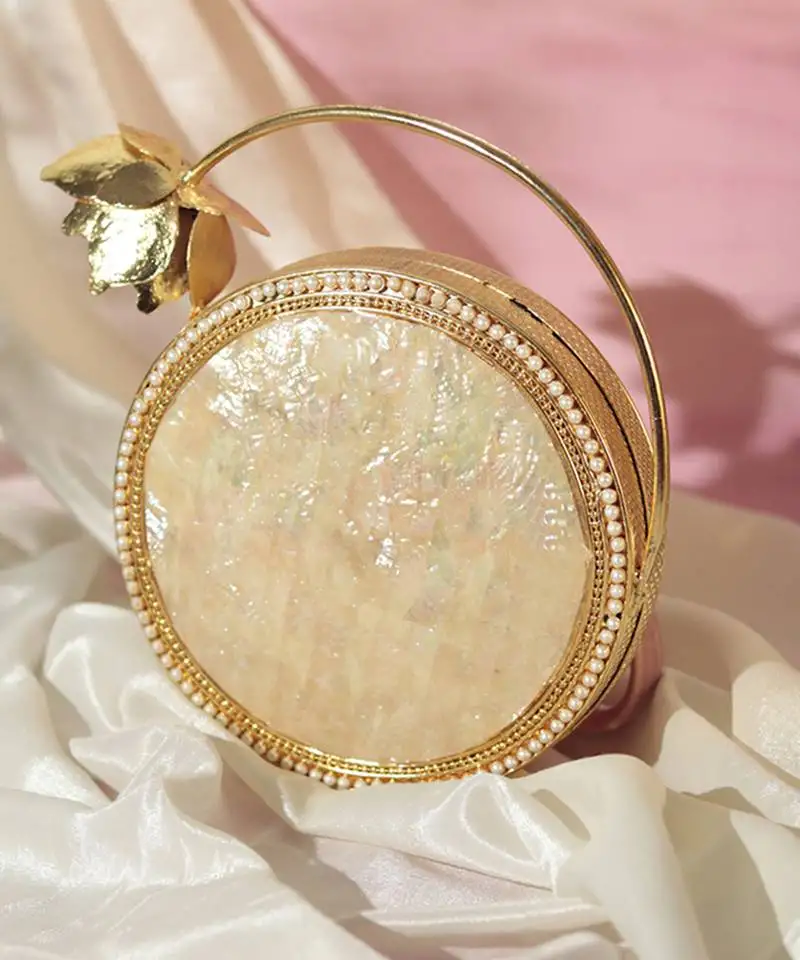 Gold embellished mother of pearl clutch