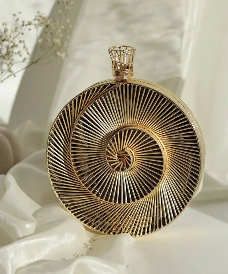 Gold intricate brass wirework clutch