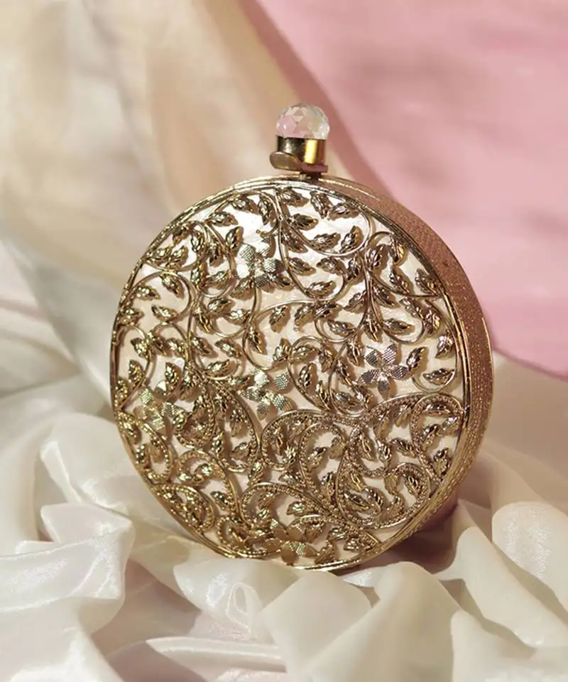 Gold intricate brass work pearl clutch