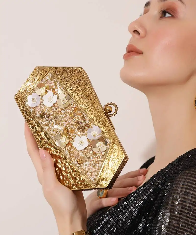 Gold embellished clutch with detachable chain
