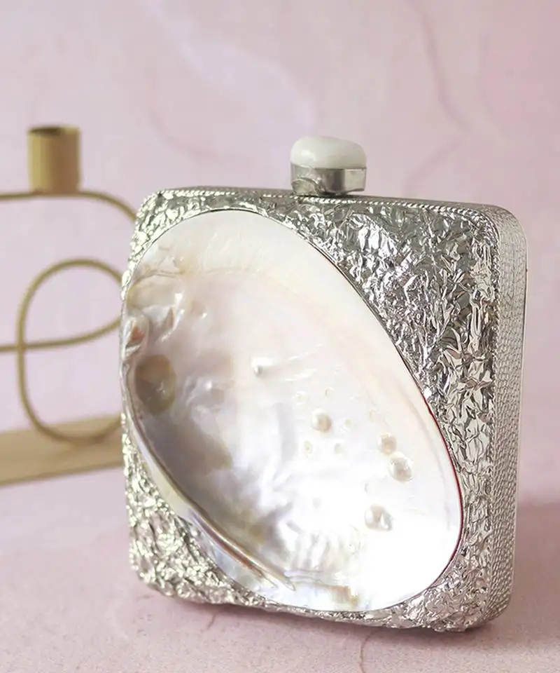 Silver clutch handcrafted with intricate detailing