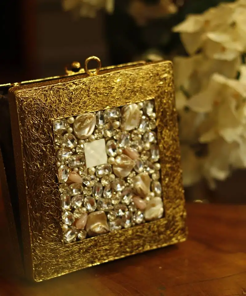 Gold embellished brass clutch for women
