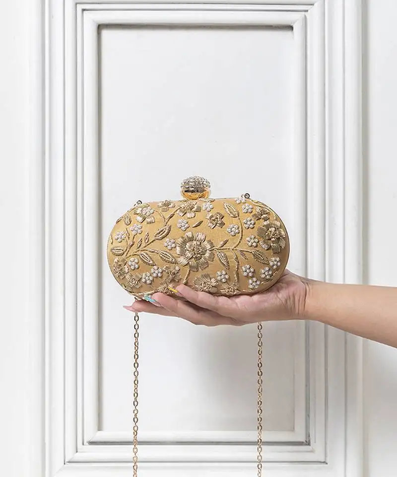 Gold hand embroidered silk clutch