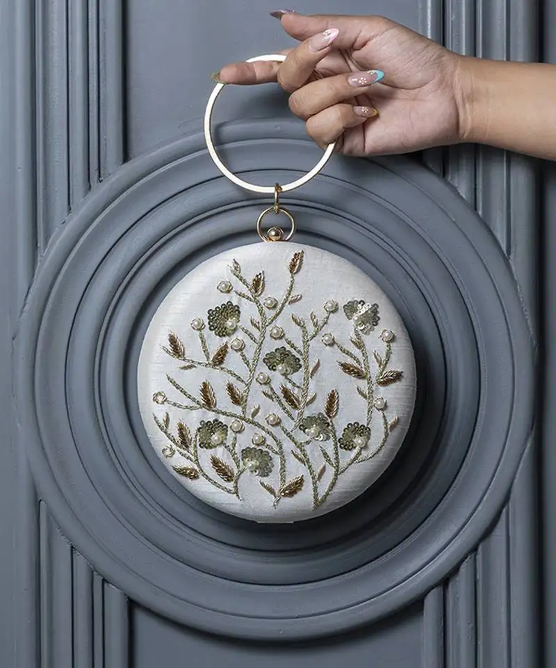 Hand embroidered white silk clutch