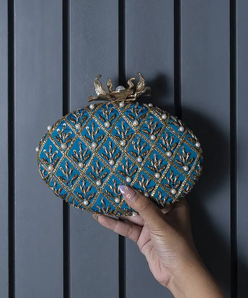Blue hand embroidered silk clutch