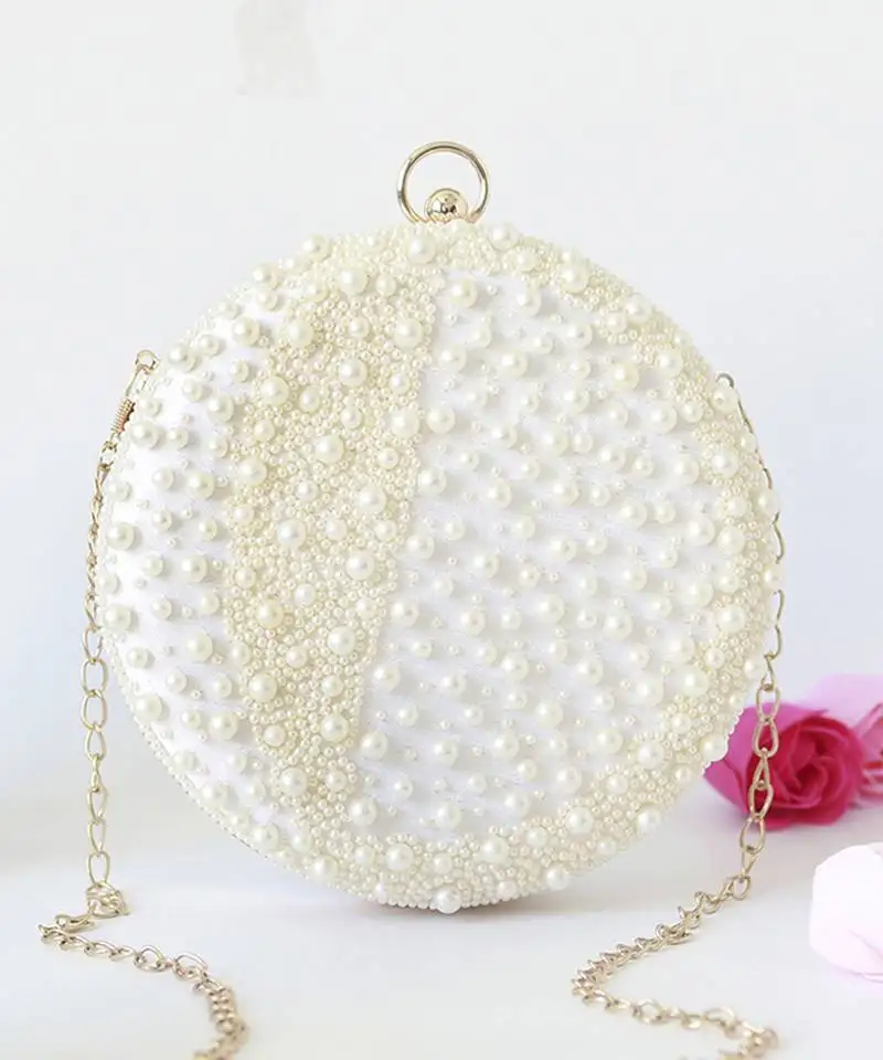 White hand embroidered clutch with pearl details