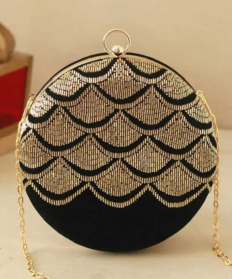Gold silk clutch with hand embroidered details
