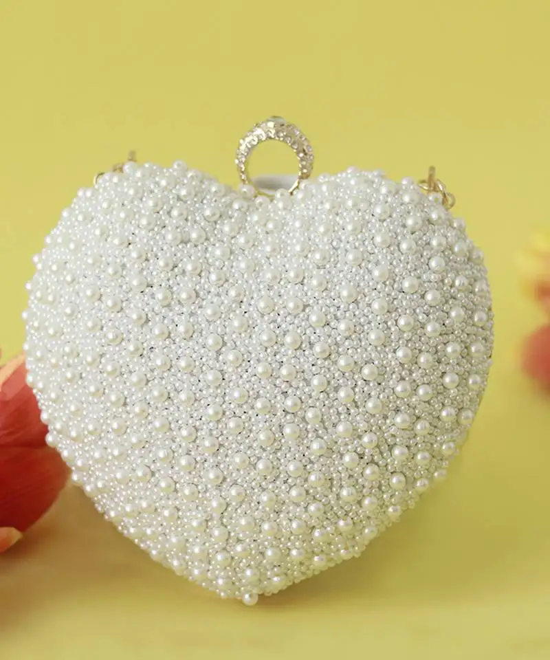 All white pearl hand embroidered heart clutch