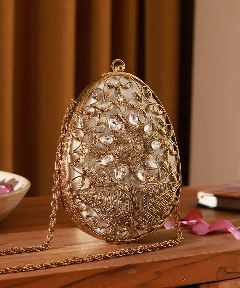 Gold intricate brass clutch