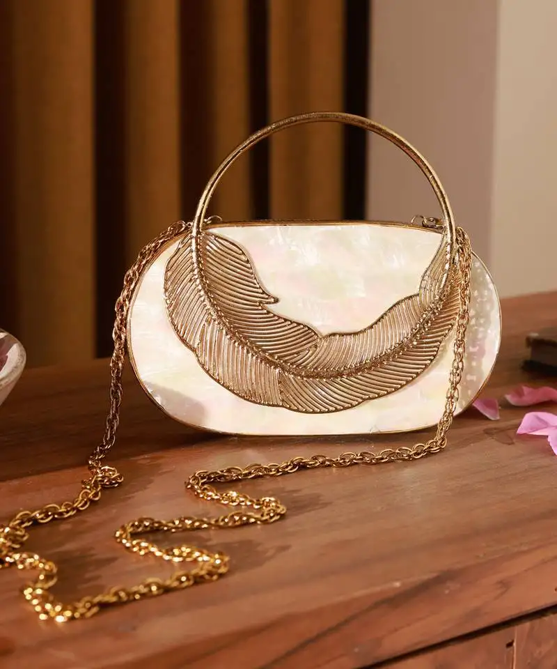 Handcrafted gold clutch with removeable chain