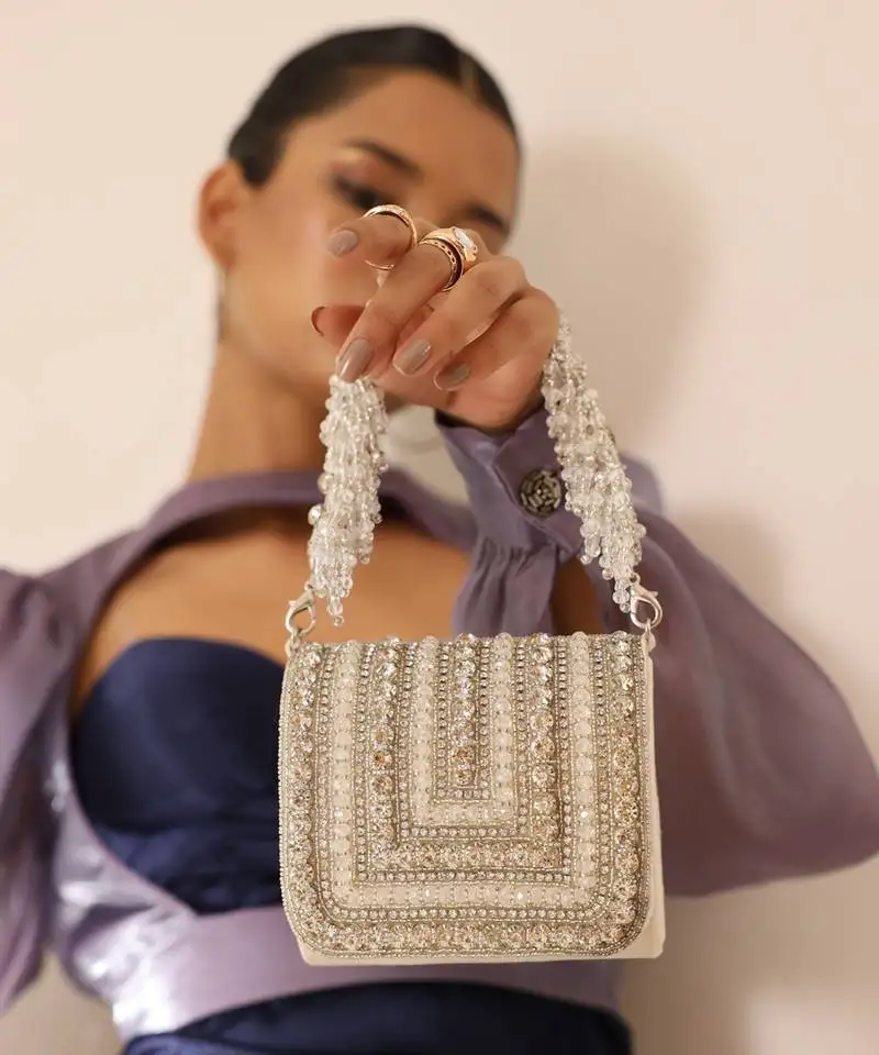 White suede mini bag with embroidered handle