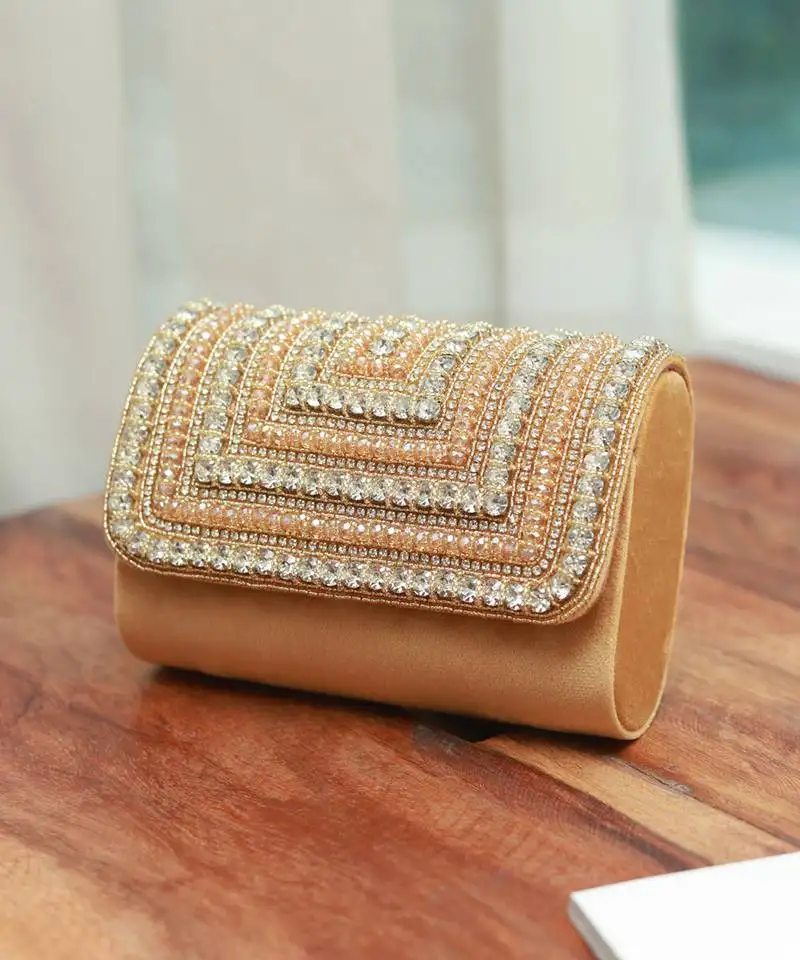 Gold suede embellished flap over clutch bag