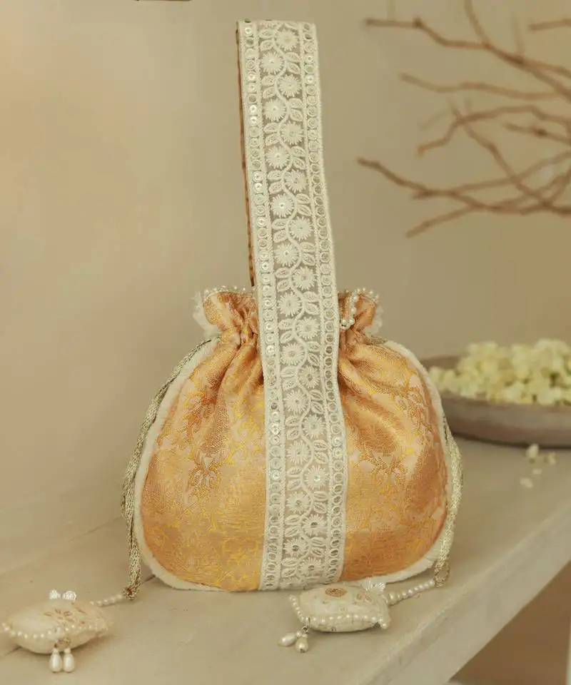 Yellow silk potli bag with handle