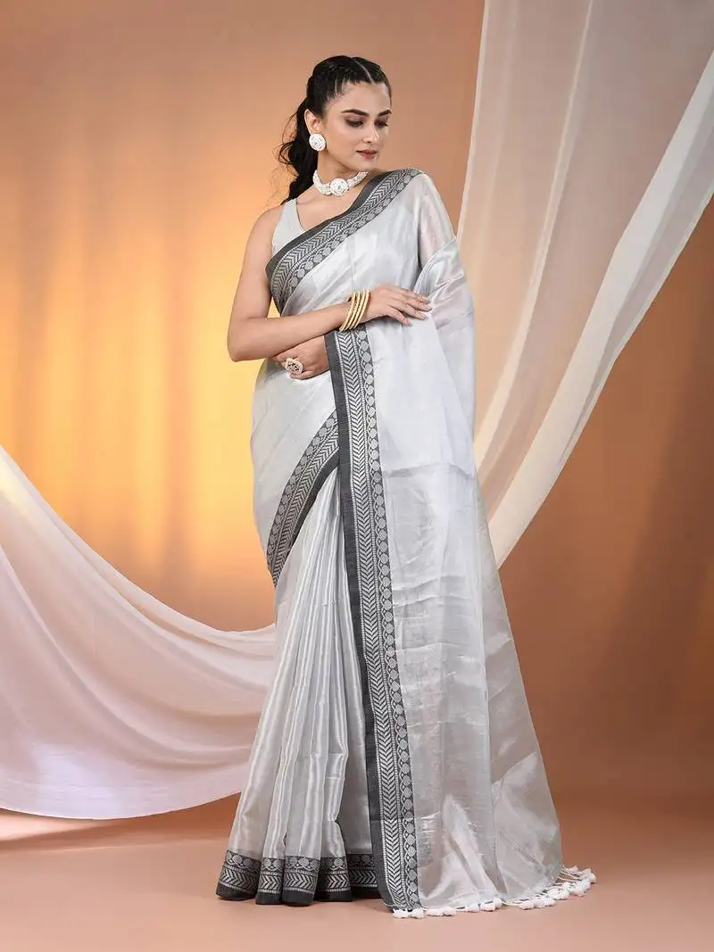 Silver shimmer tissue saree with nakshi borders