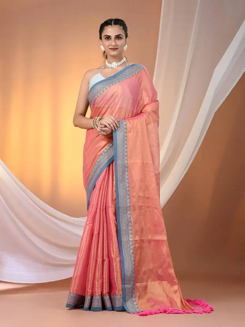Peach shimmer tissue saree with nakshi borders