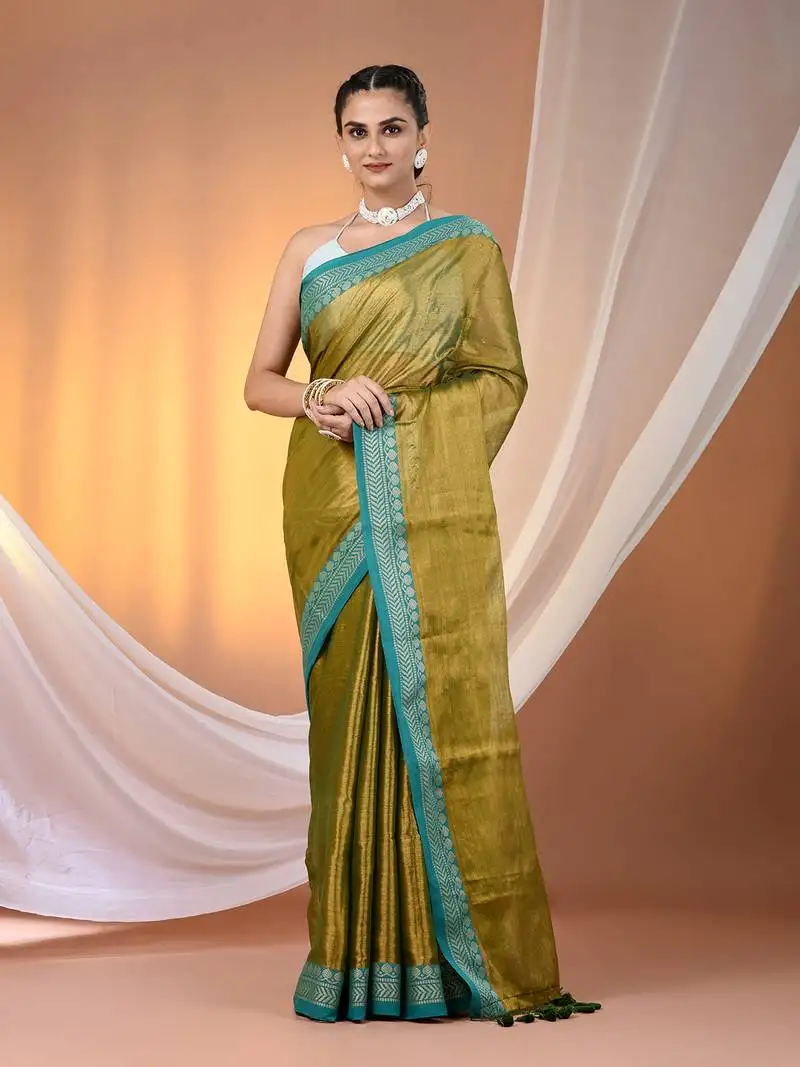 Sap green shimmer tissue saree with nakshi borders