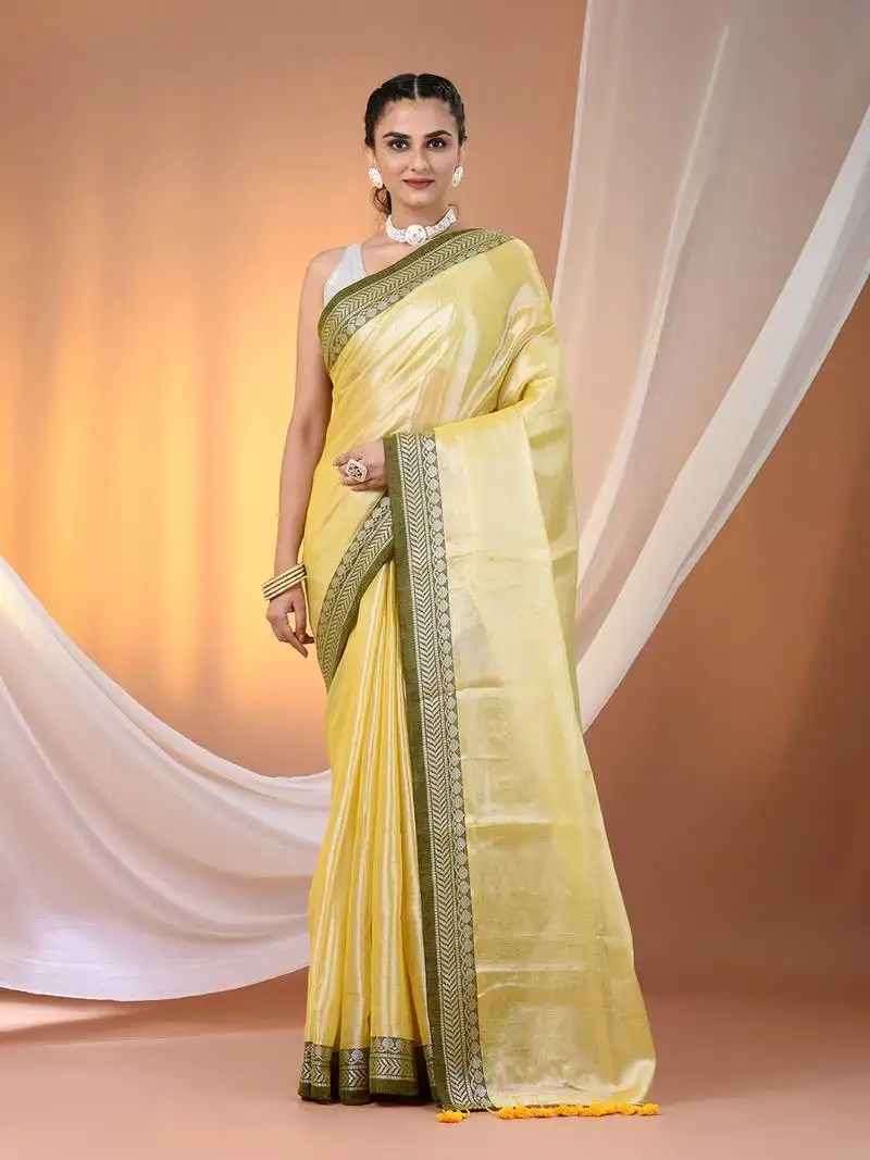 Yellow shimmer tissue saree with nakshi borders