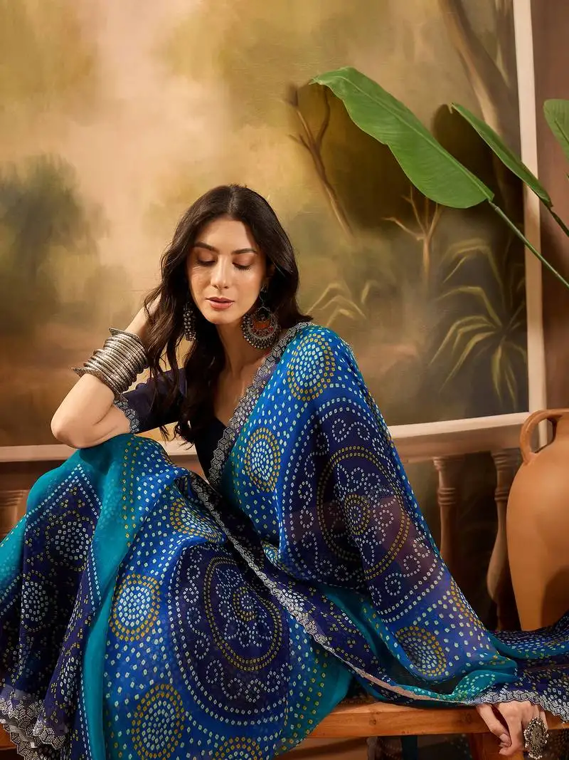 Women's blue georgette bandhni saree with unstitched blouse piece