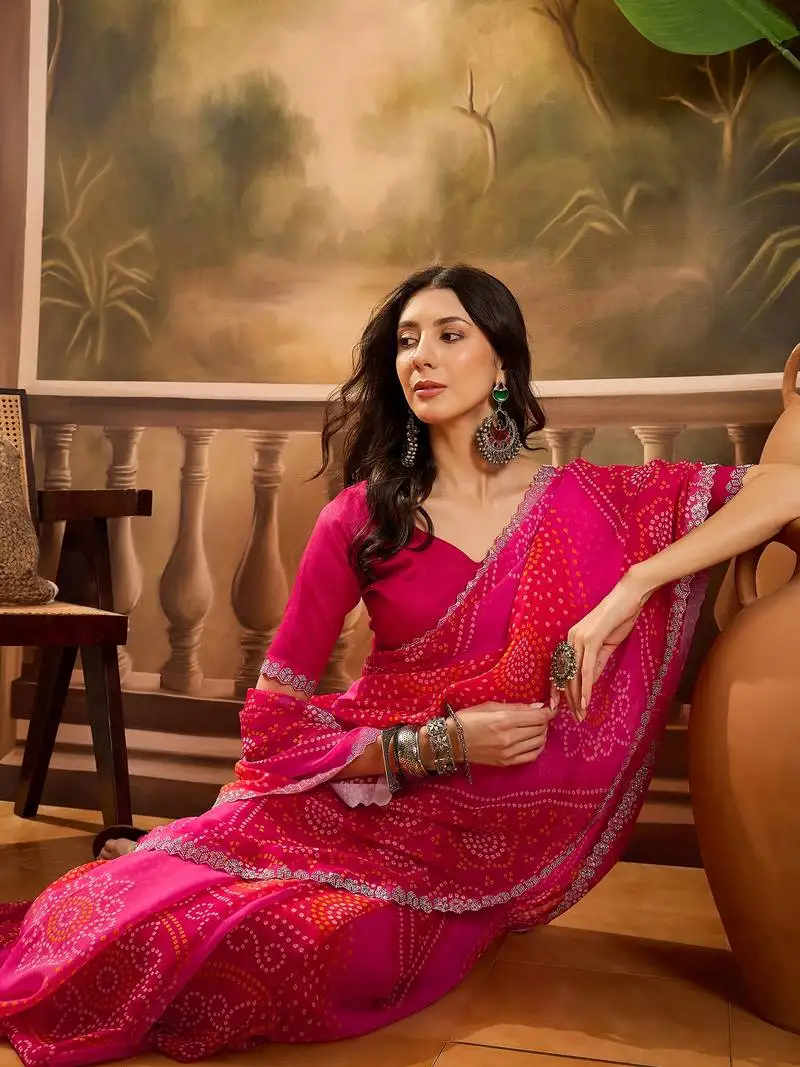 Women's pink georgette bandhni saree with unstitched blouse piece