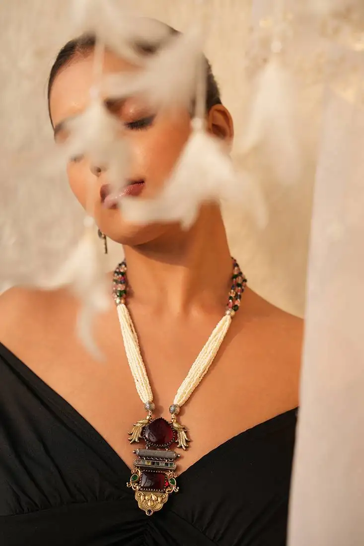 Avira long necklace set with maroon gemstone and peacock pendant