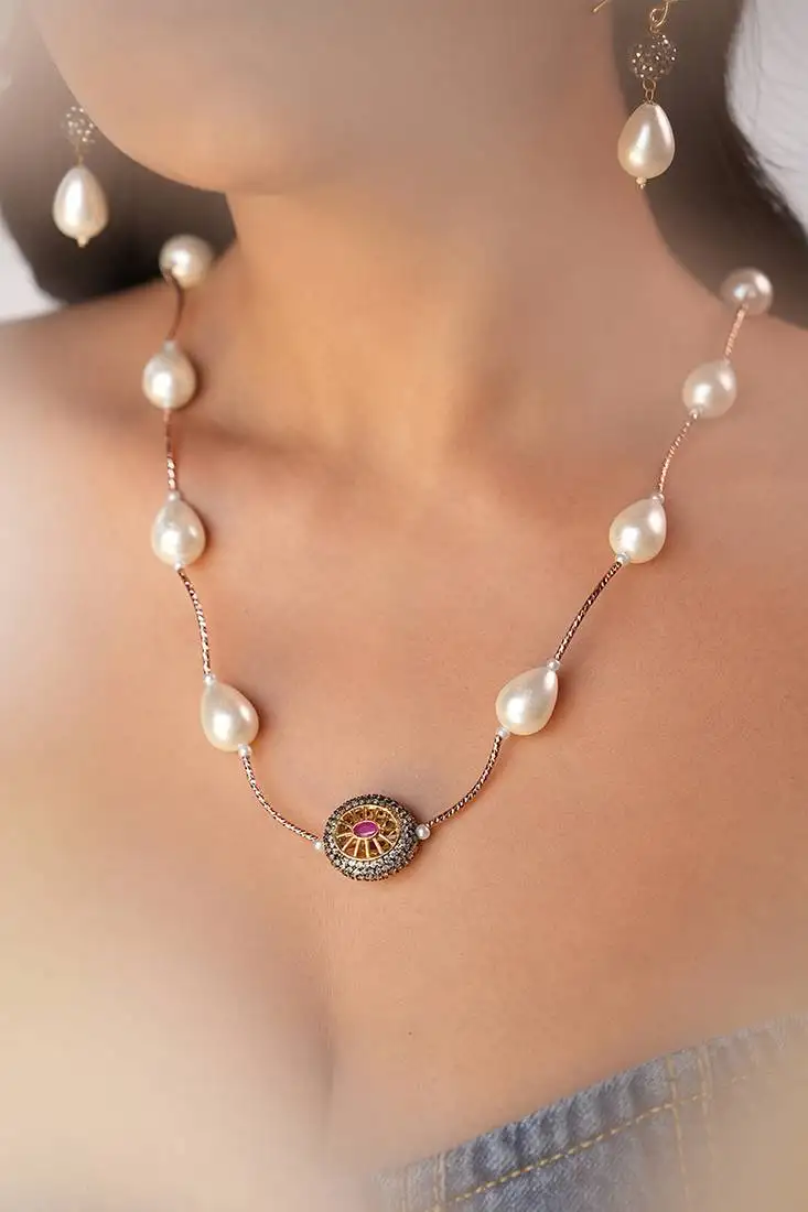White quartz stone necklace with dual-tone pendant