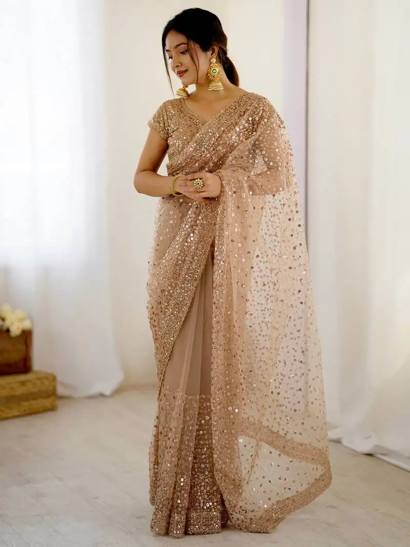 Gorgeous gold net sequins party wear saree with blouse