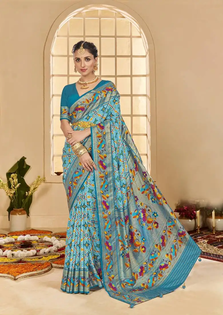 Turqoise blue woven border with ikkat printed cotton silk blend saree