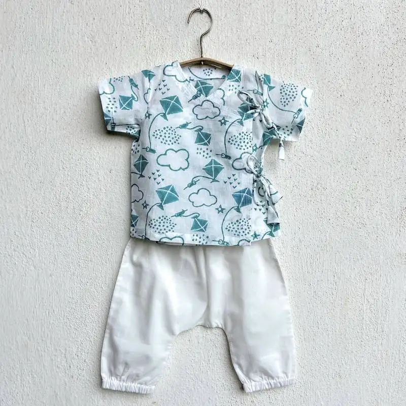 Organic patang teal angarakha top + white pants