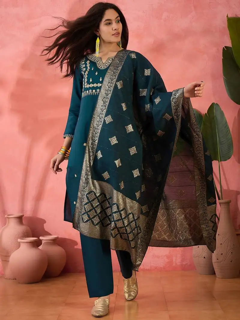 Teal blue roman silk suit designed with embroidery work and wevon designer