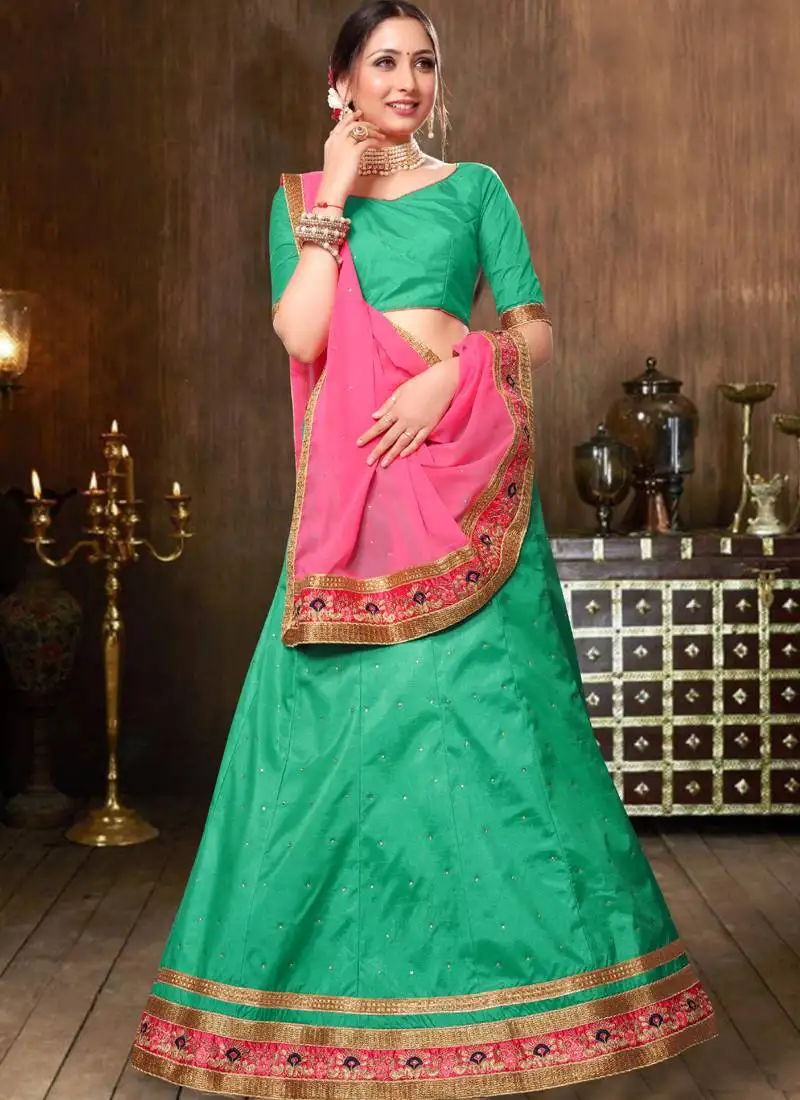 Turquoise embellished silk party wear ethnic lehenga