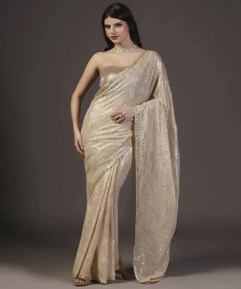 Nude and gold sequins hand embroidered georgette saree with unstitched blouse sets of 2