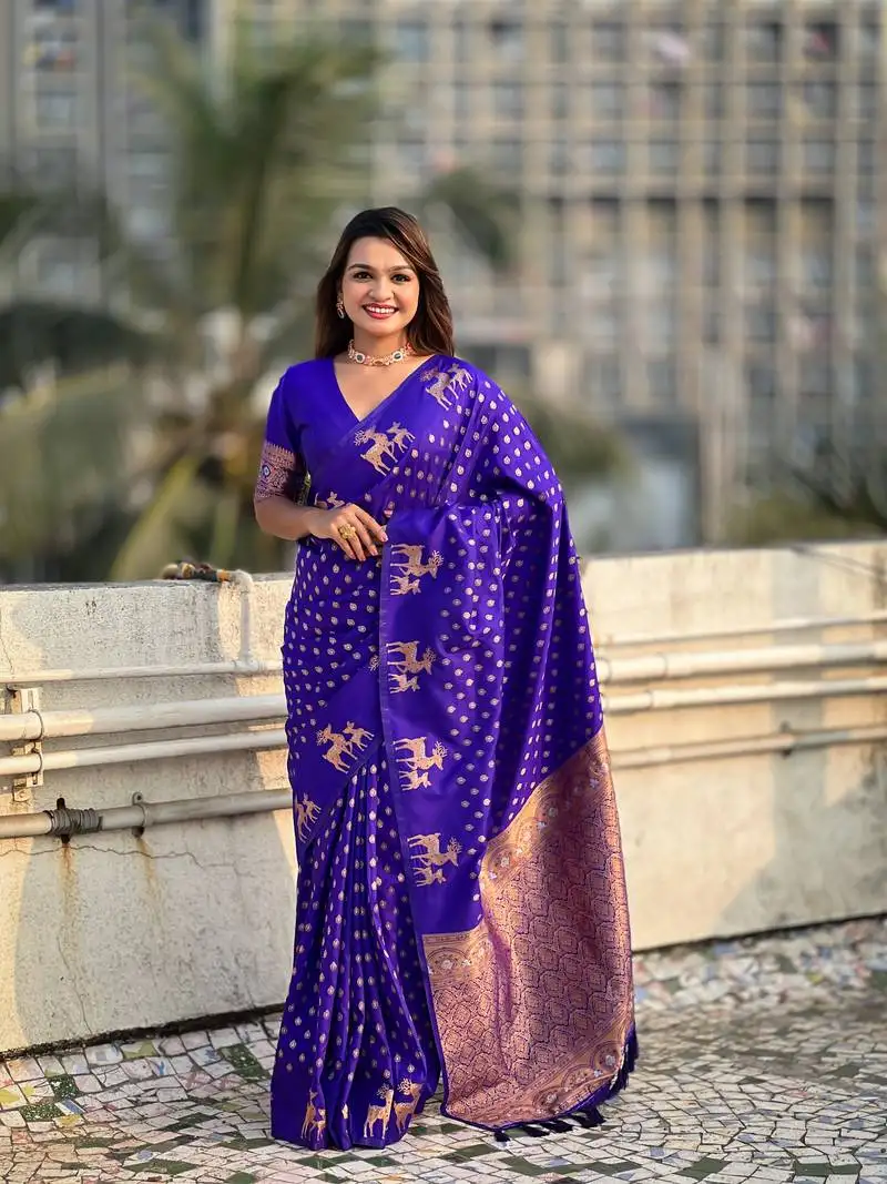 Violet soft silk blend dual zari woven saree with deer border