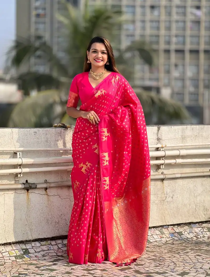 Pink soft silk blend dual zari woven saree with deer border