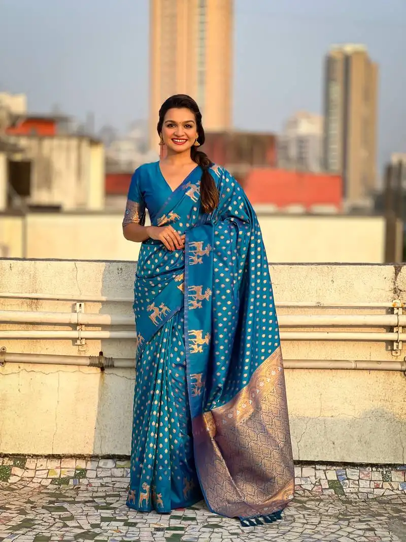 Blue soft silk blend dual zari woven saree with deer border