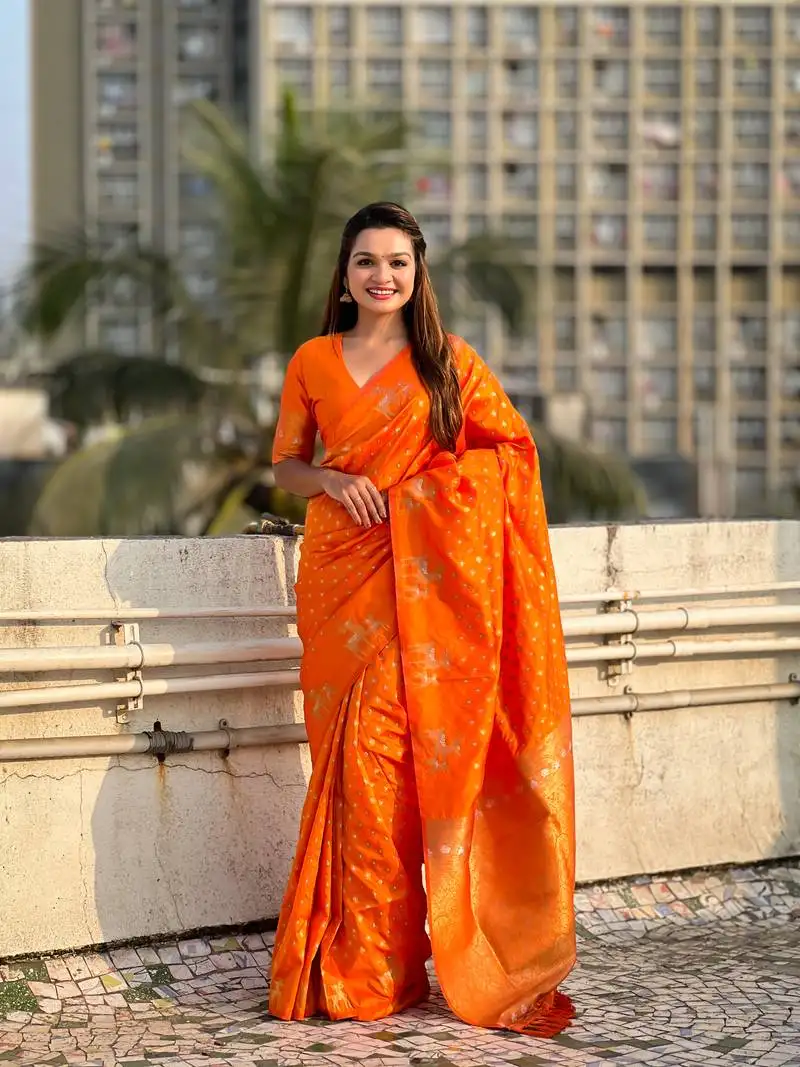 Orange soft silk blend dual zari woven saree with deer border