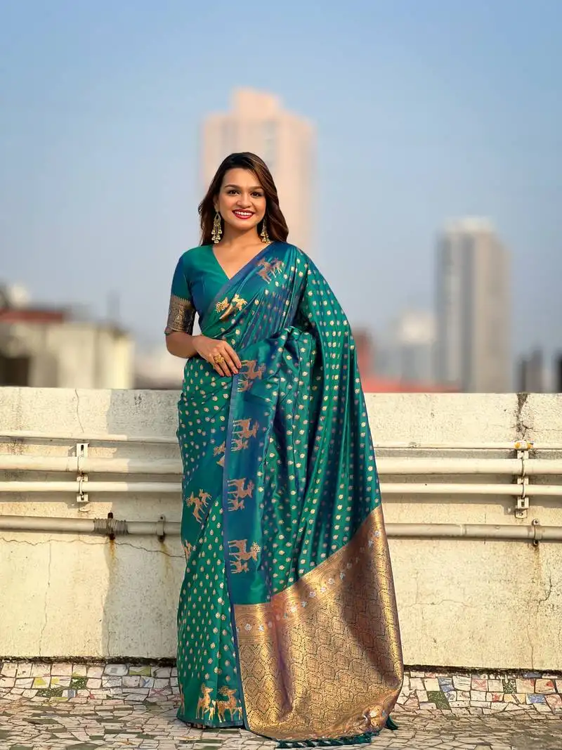 Green soft silk blend dual zari woven saree with deer border