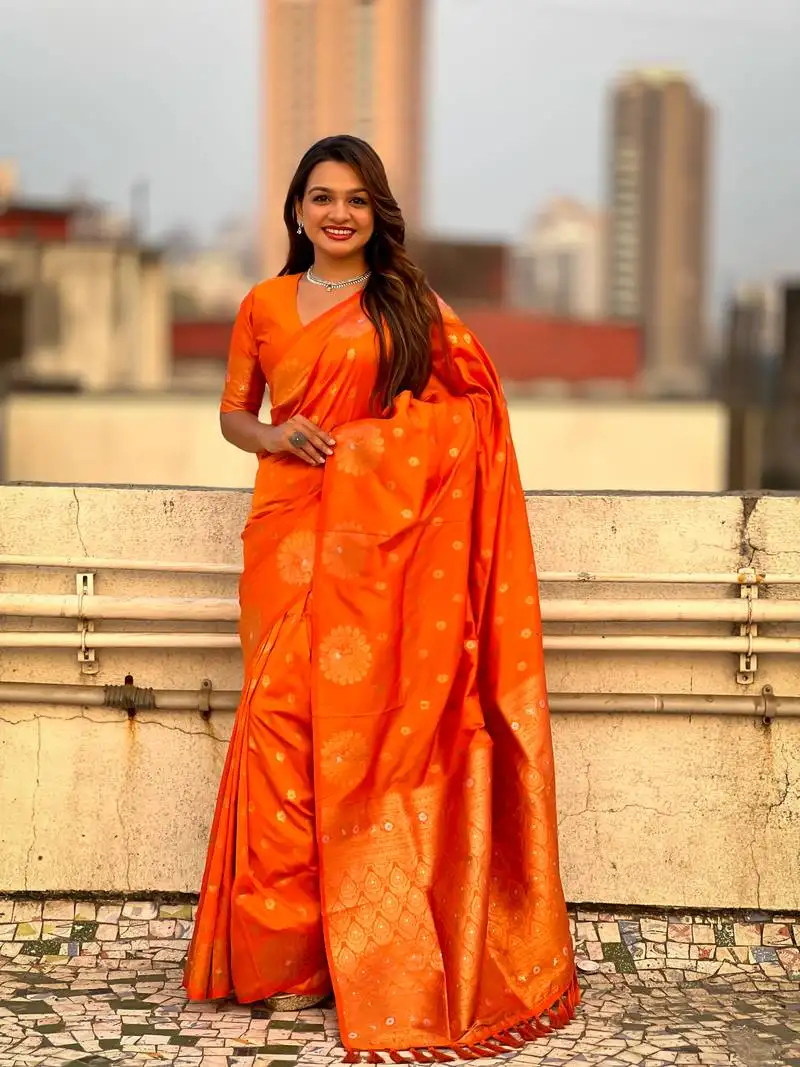 Orange soft silk blend dual zari woven saree with peacock border
