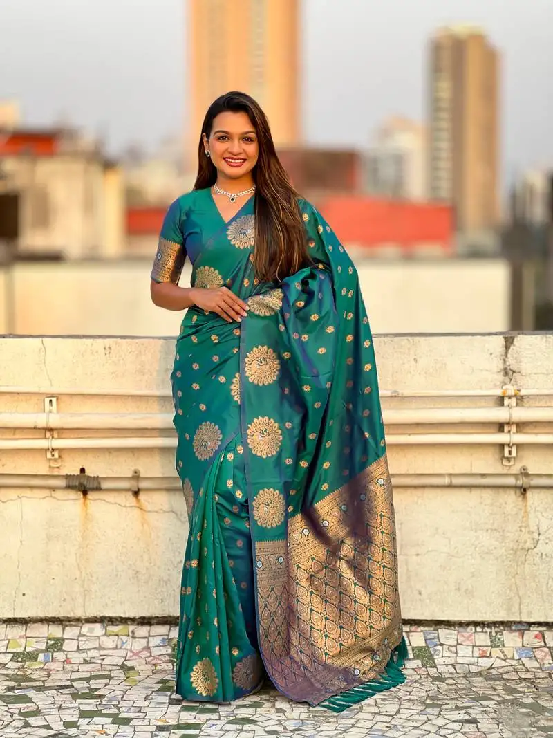 Green soft silk blend dual zari woven saree with peacock border