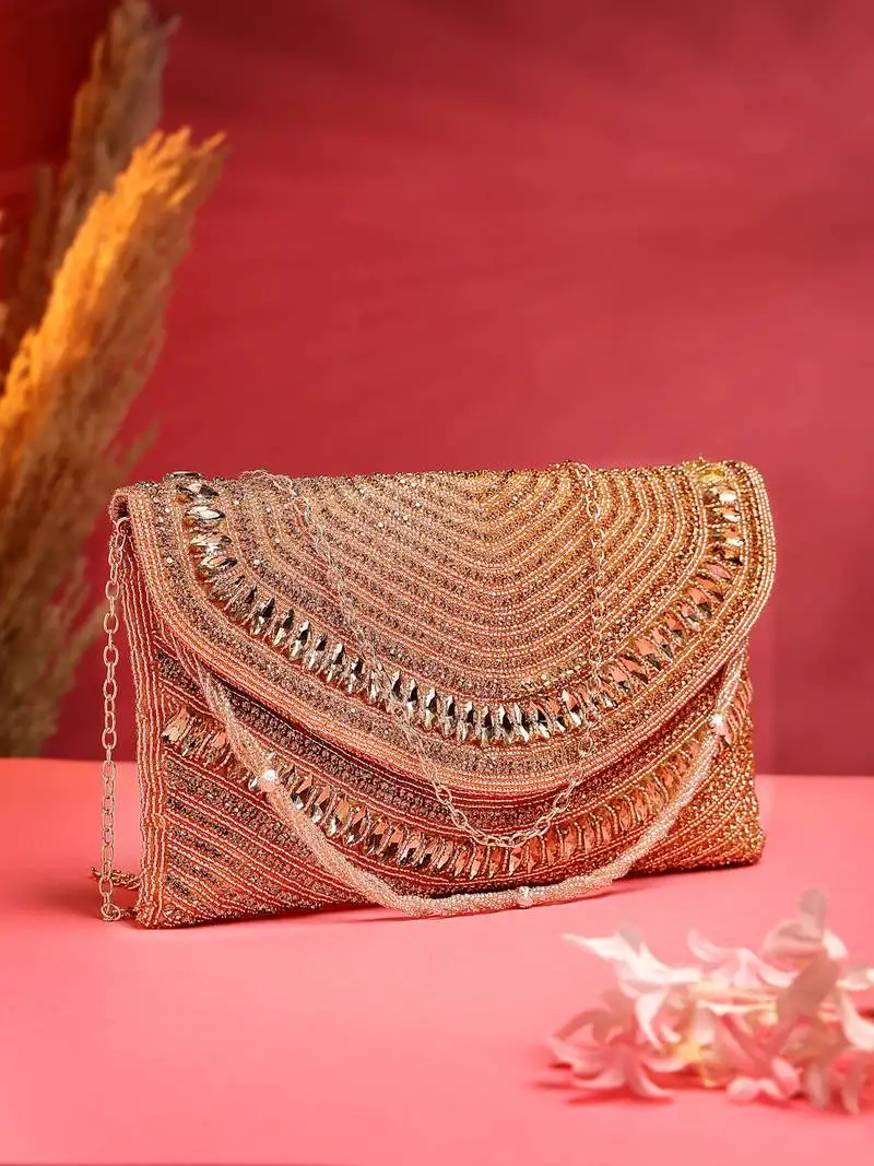 Adorn coral & gold stone work embellished faux silk clutch