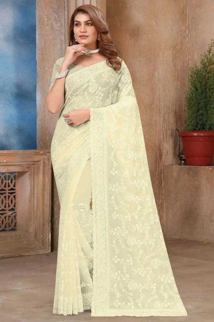 Off white sequin embroidered georgette saree with unstitch blouse piece