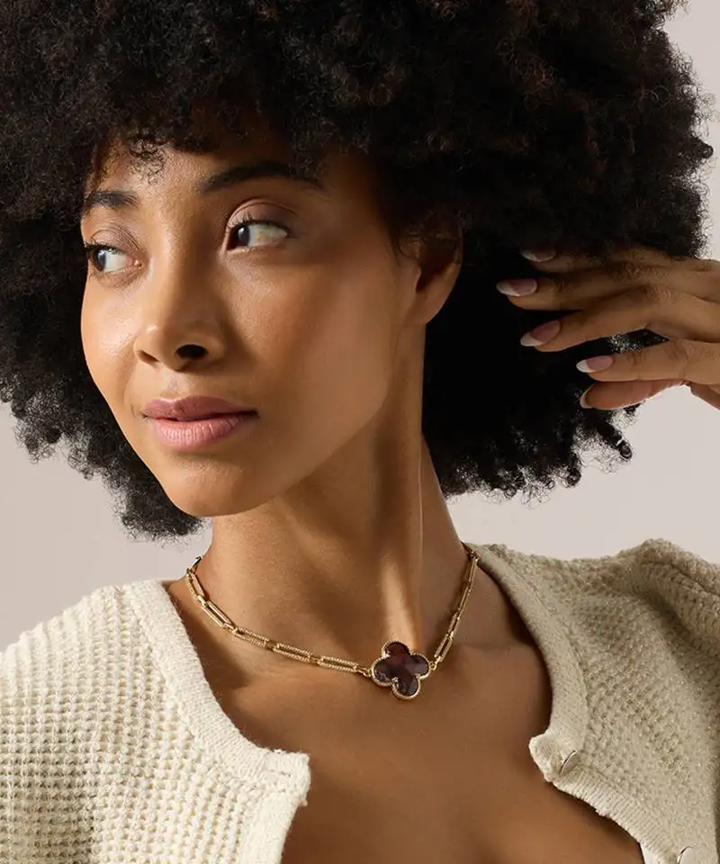 Purple brass studded pendant necklace with yellow gold plating