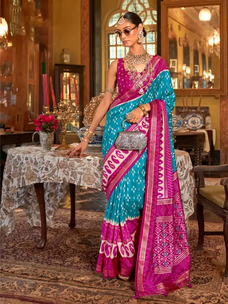 Turquoise blue polyester viscose silk blend patola printed saree