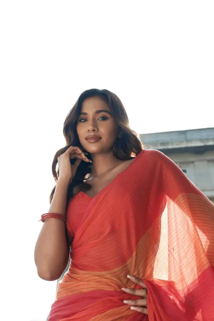 Red handwoven mul cotton saree with checks & tassels