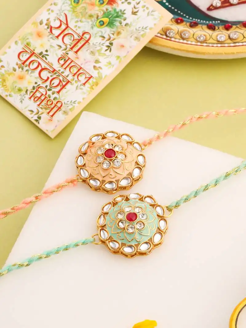 Men set of 2 peach & green kundan studded round floral design rakhi with roli chawal chandan & mishri
