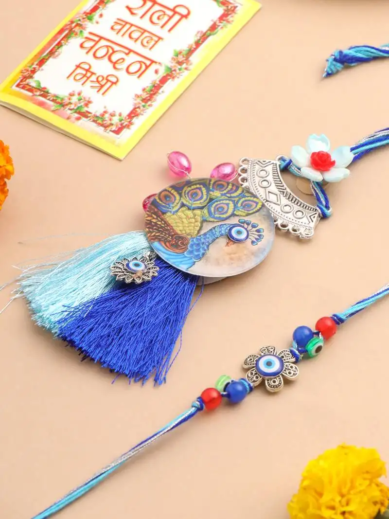 set of 2 blue evil eye & peacock design artificial beads bhaiya bhabhi rakhi with roli chawal chandan & mishri