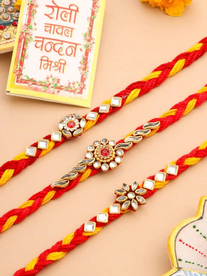 set of 3 red & yellow kundan studded floral design thread rakhi with roli chawal chandan & mishri